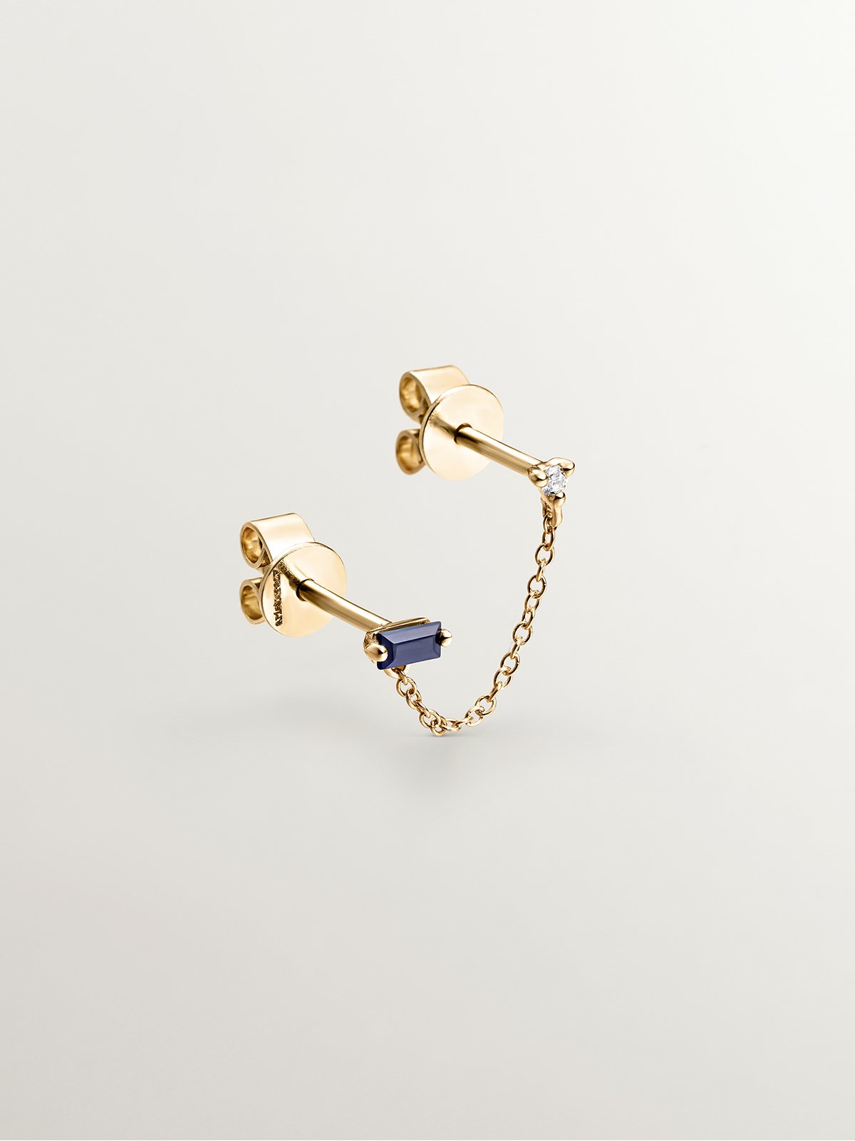 Pendiente individual trepador de oro amarillo de 9K con zafiro azul y diamante
