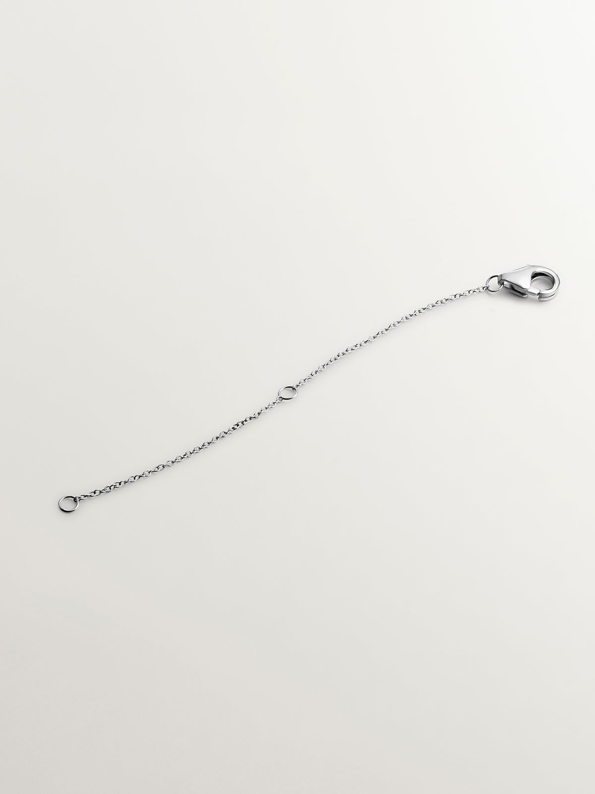 Alargador de oro blanco de 9K