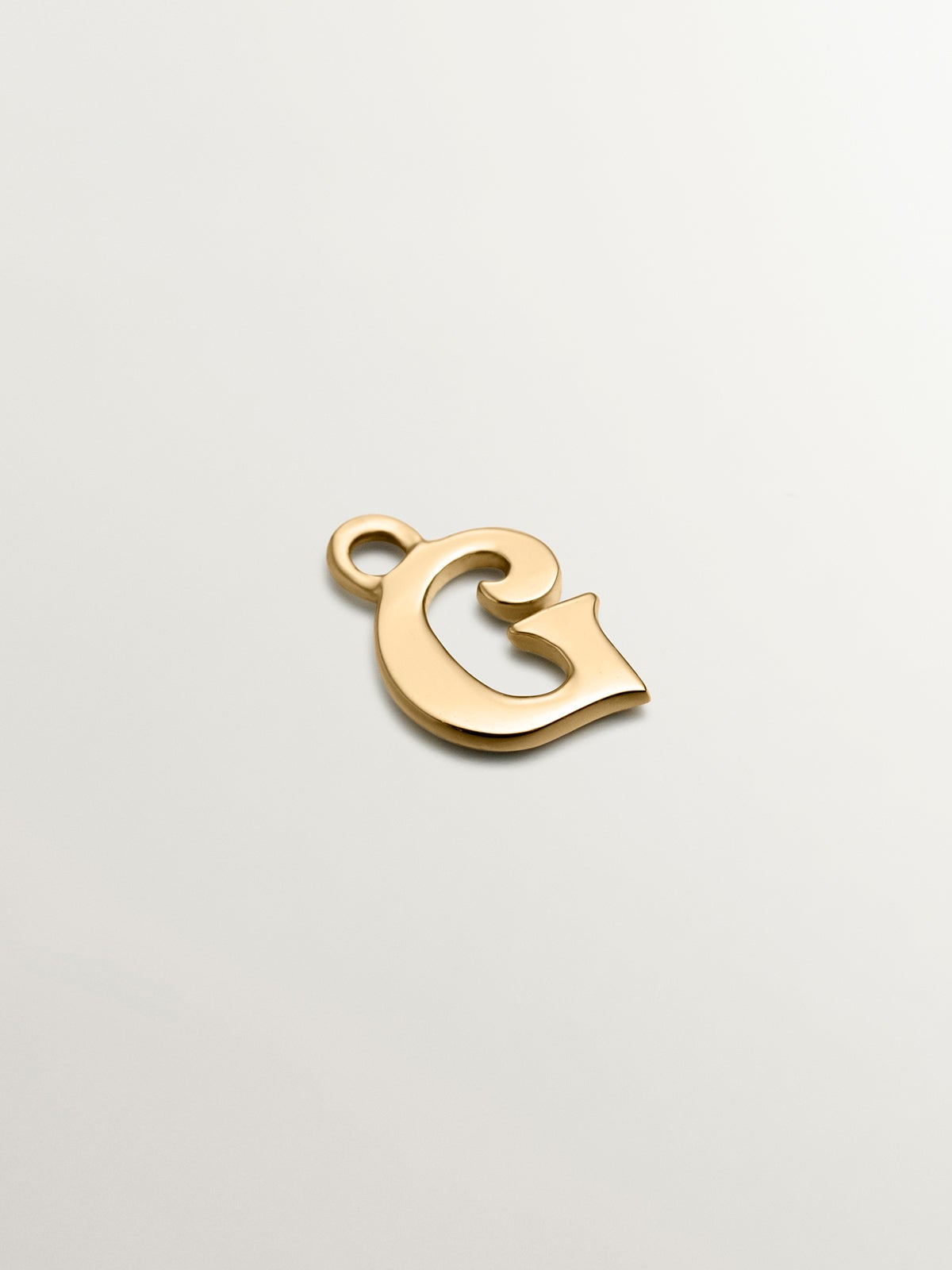 Charm de oro amarillo de 14K con letra G