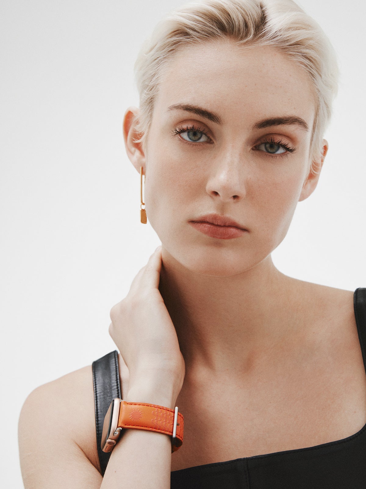 Correa para Apple Watch de cuero naranja con estampado de soles