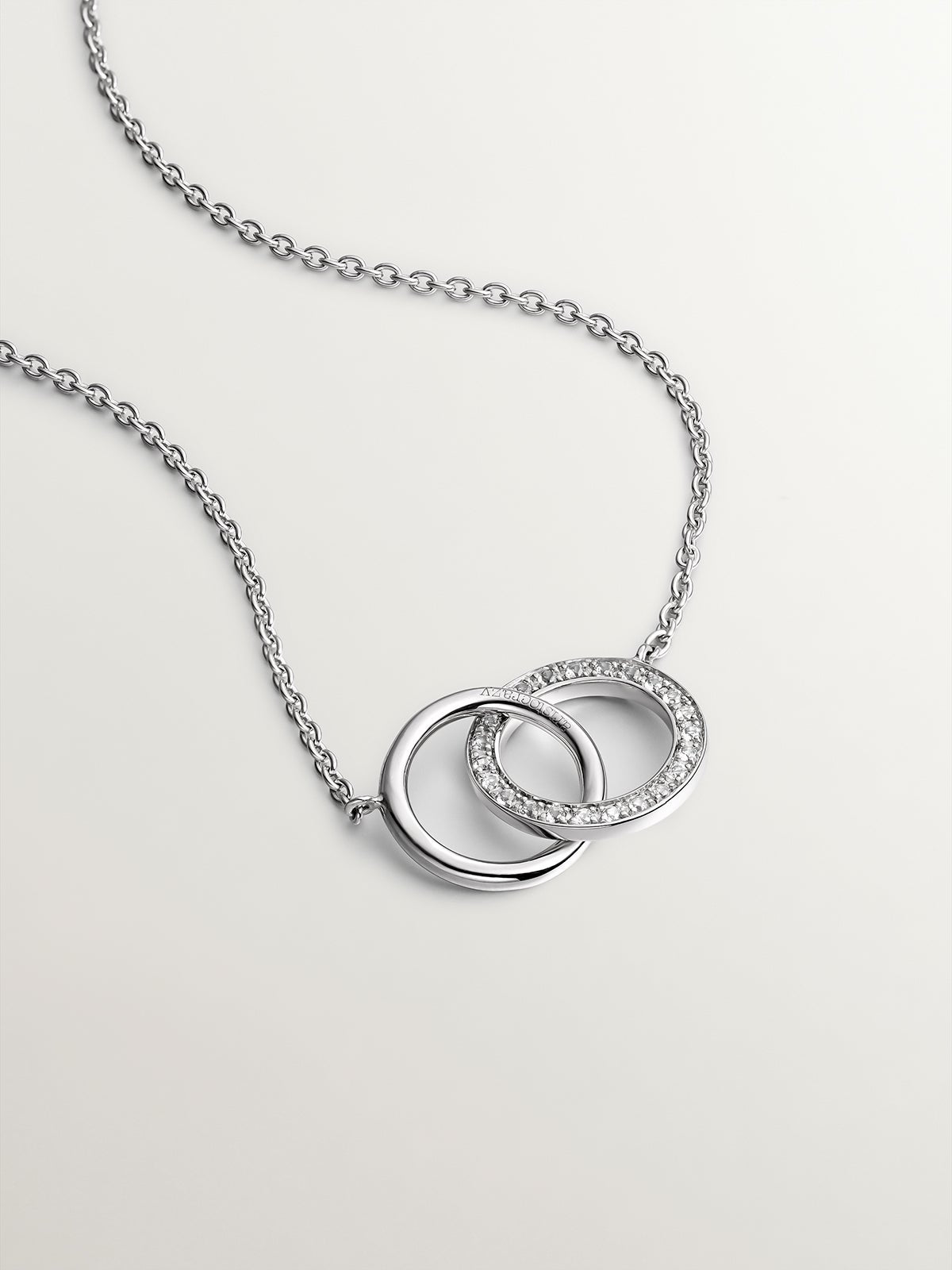 Colgante de plata 925 con círculos y topacios blancos