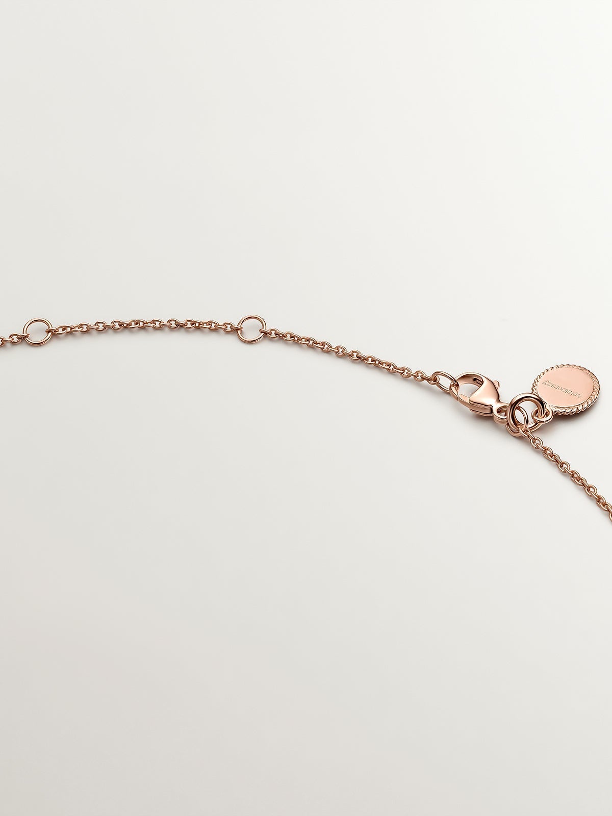 Colgante de plata 925 bañada en oro rosa de 18K con círculos y espinelas negras