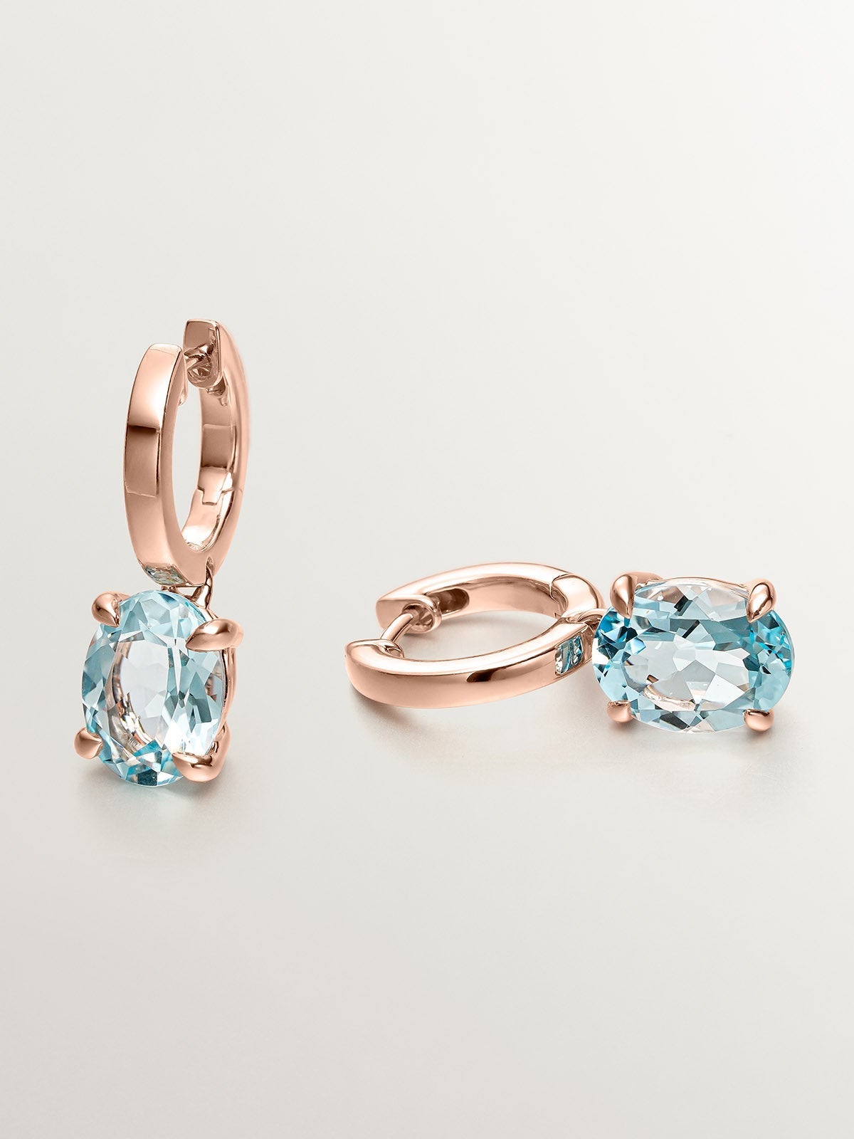 Pendientes de plata 925 bañada en oro rosa de 18K con topacio azul sky