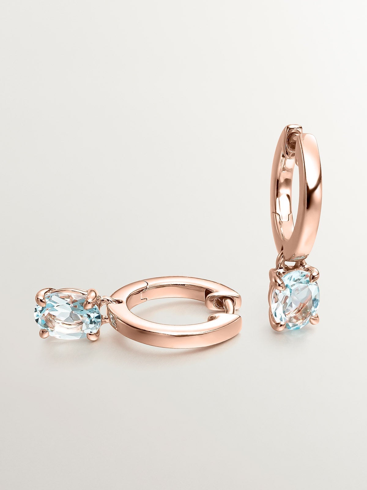 Pendientes de plata 925 bañada en oro rosa de 18K con topacio azul sky