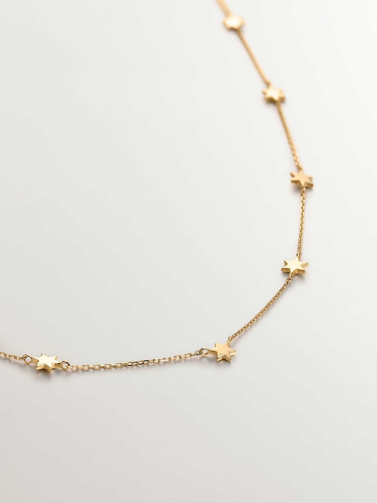 Collar de oro amarillo de 9K con estrellas