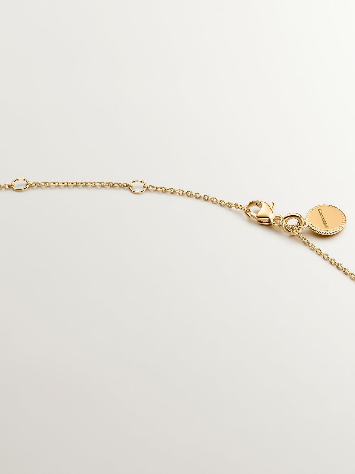 Colgante de plata 925 bañada en oro amarillo de 18K con cruz y topacios blancos