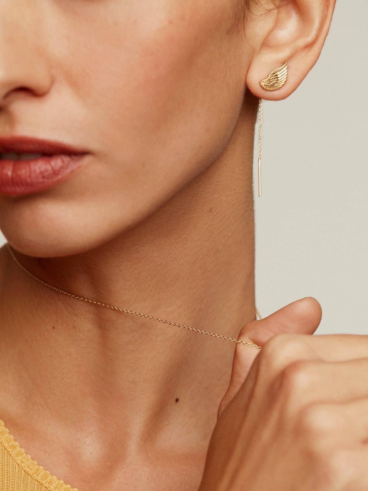 Pendientes largos de plata 925 bañada en oro amarillo de 18K con alas