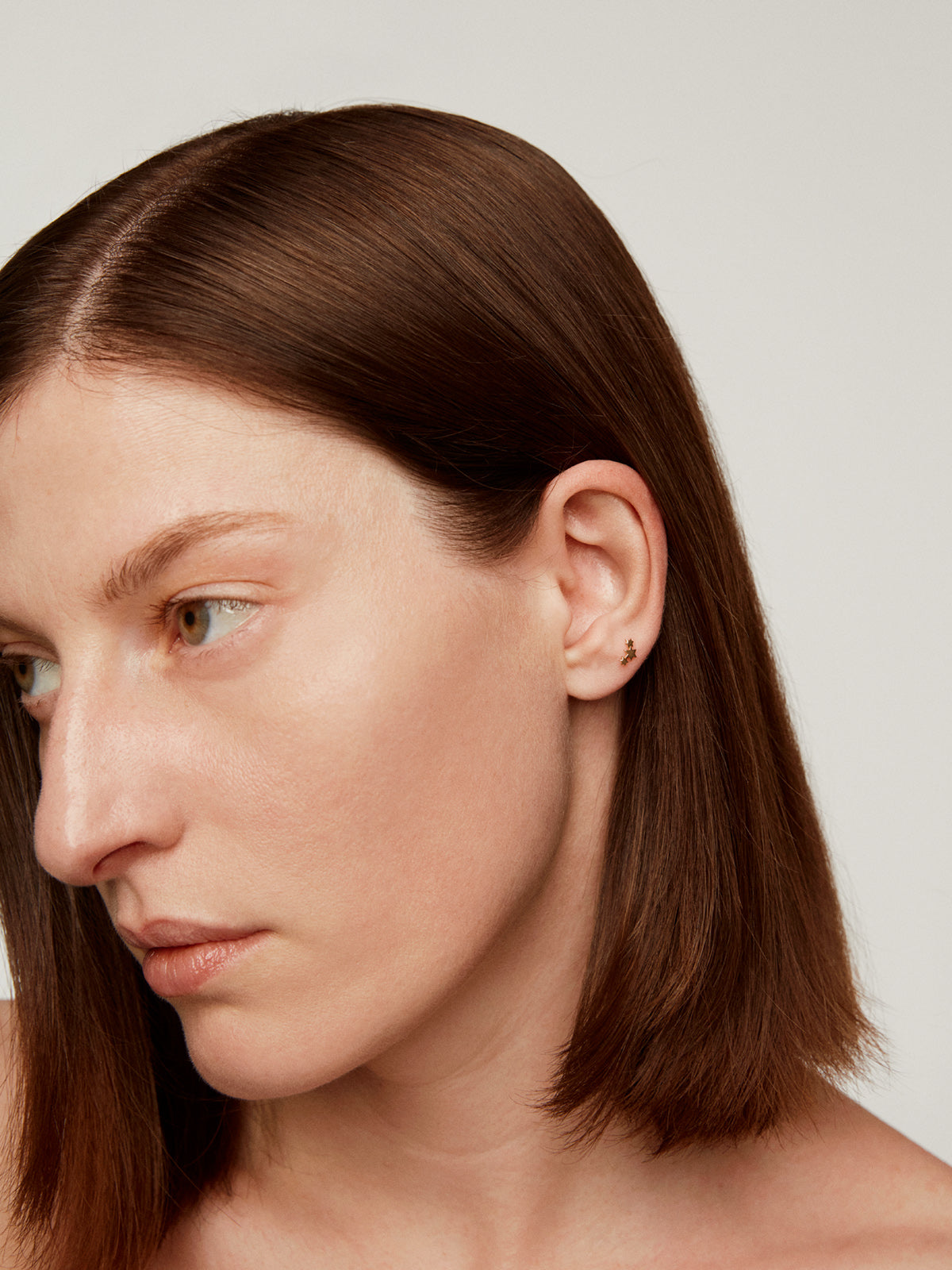 Piercing de oro amarillo de 18K con triple estrella