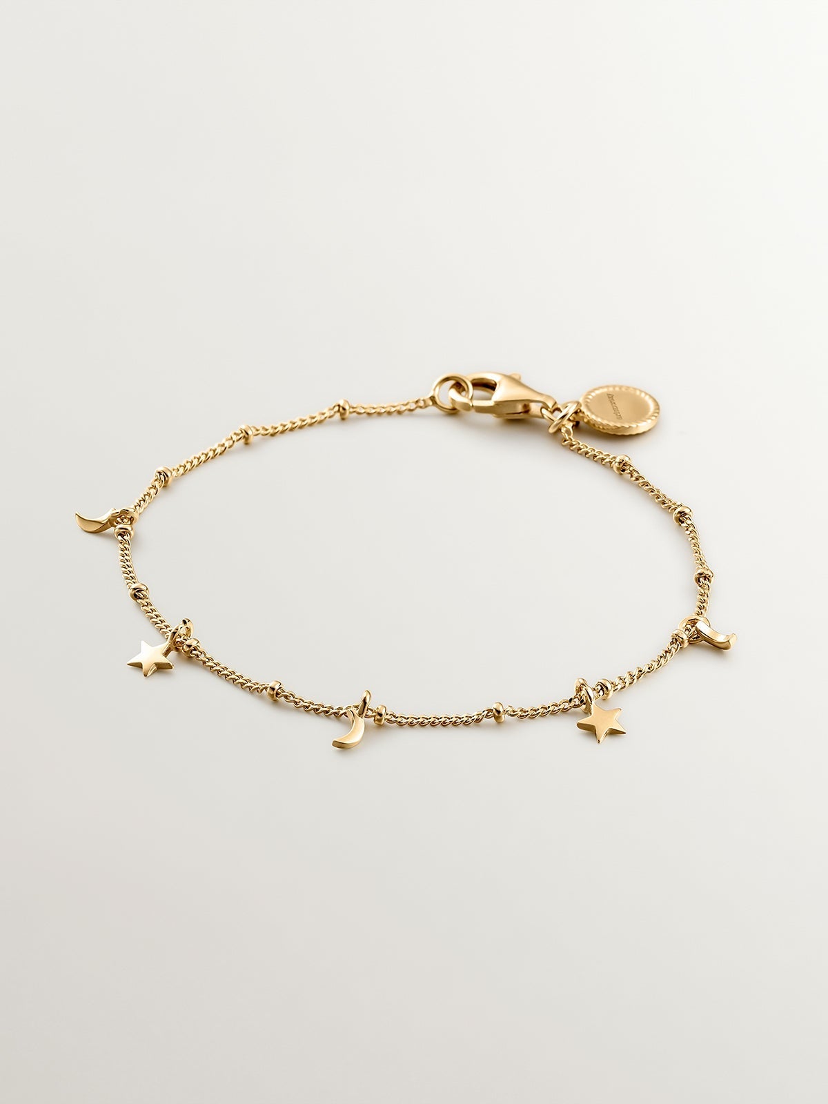 Pulsera de plata 925 bañada en oro amarillo de 18K con lunas y estrellas