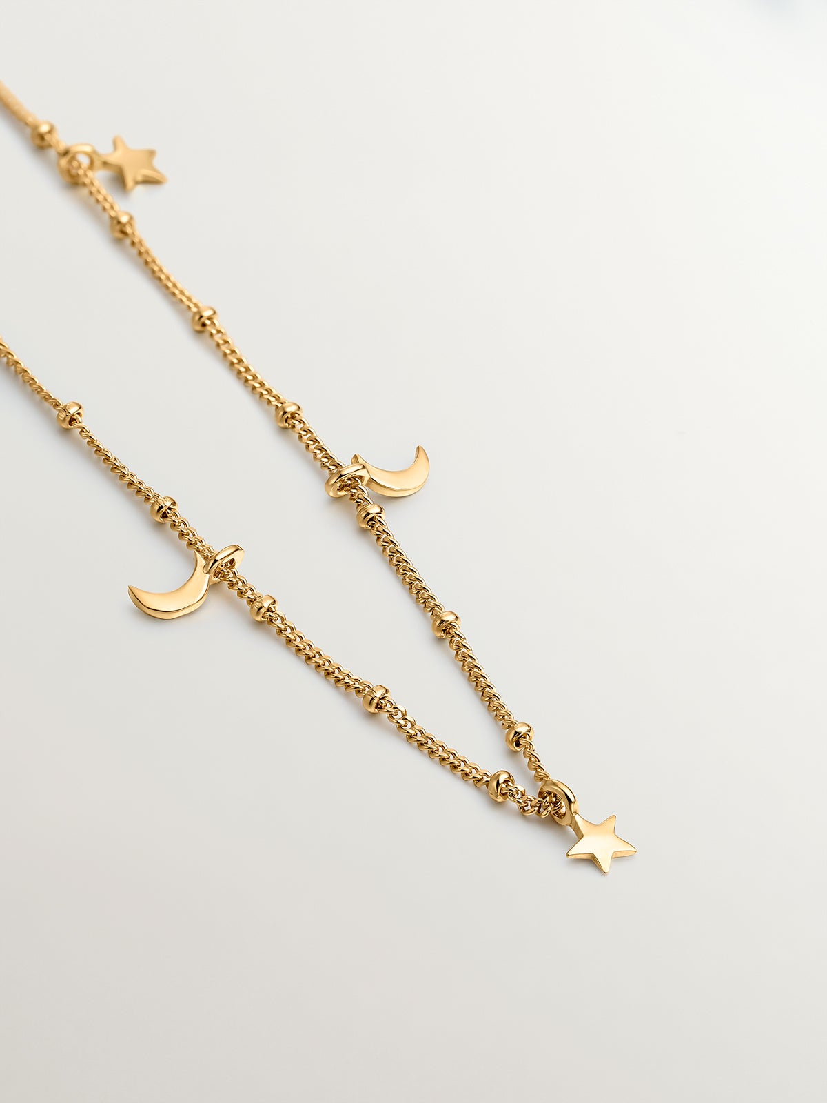 Collar de plata 925 bañada en oro amarillo de 18K con estrellas y lunas