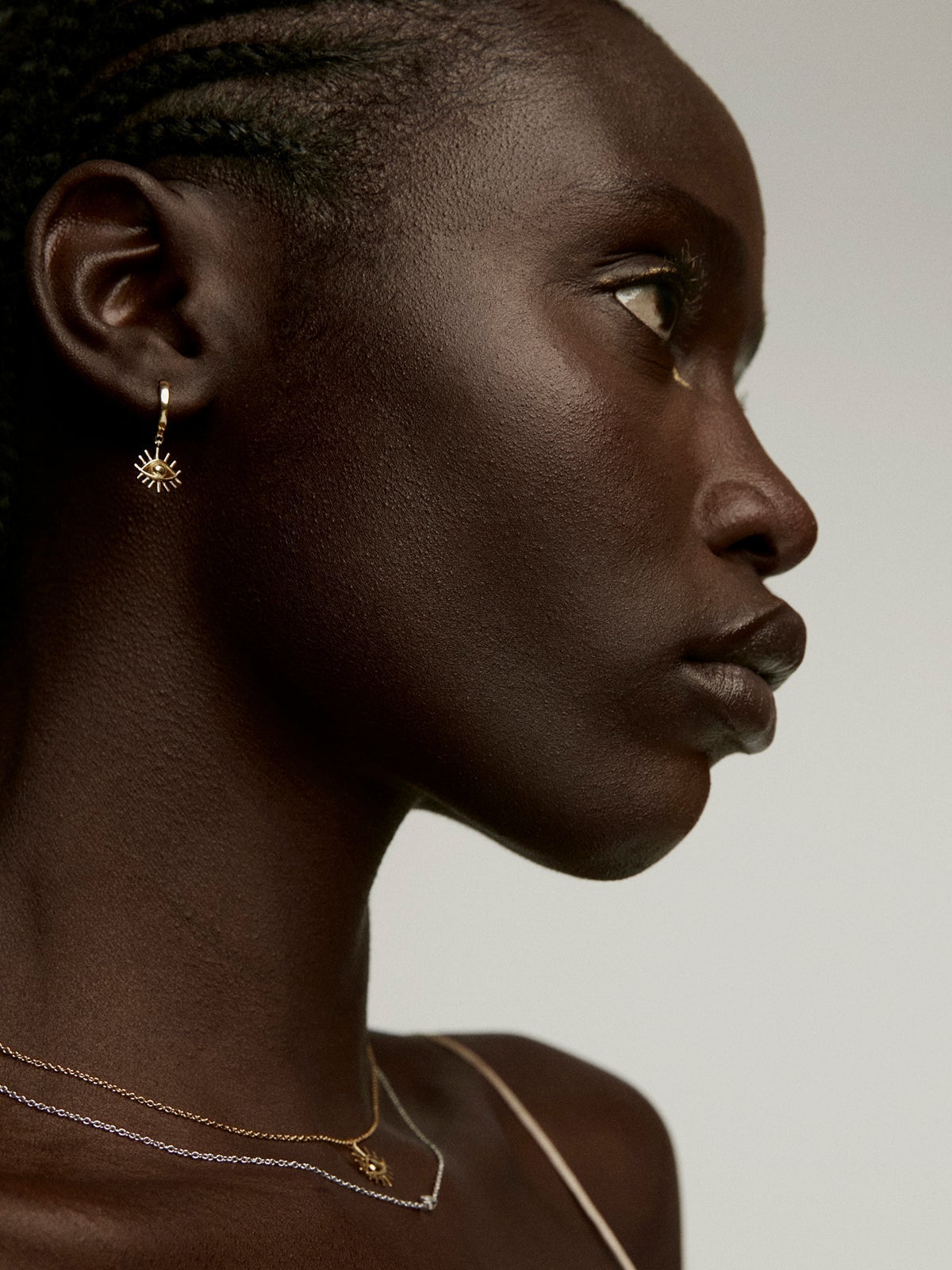 Pendientes de aro pequeños de plata 925 bañada en oro amarillo de 18K con ojo