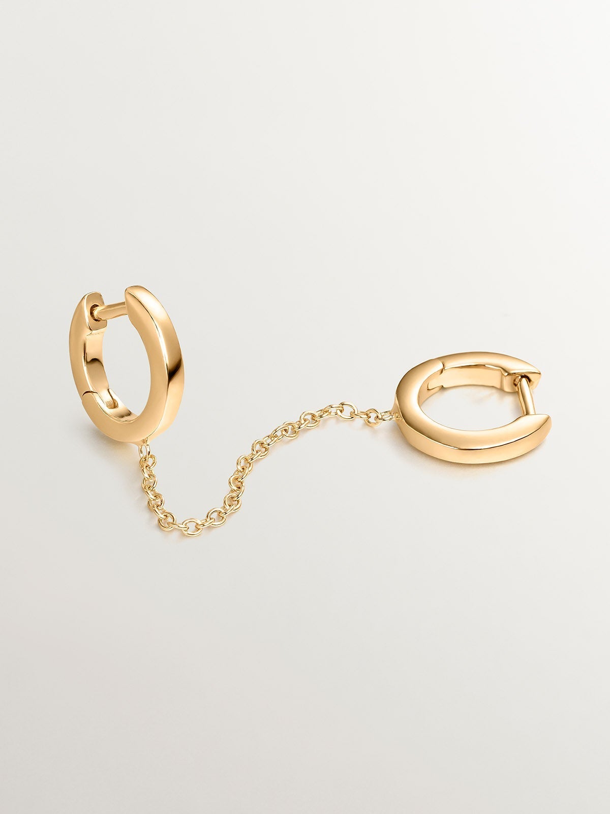 Pendiente individual trepador de plata 925 bañada en oro amarillo de 18K con doble aro