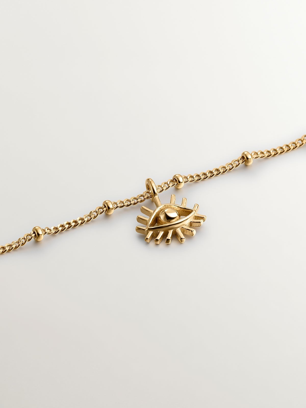 Pulsera de plata 925 bañada en oro amarillo de 18K con motivos de seta, cruz, ojo, concha y estrella
