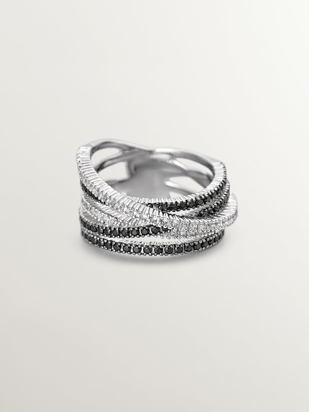 Anillo multibrazo cruzado de plata 925 con topacios blancos y espinelas negras