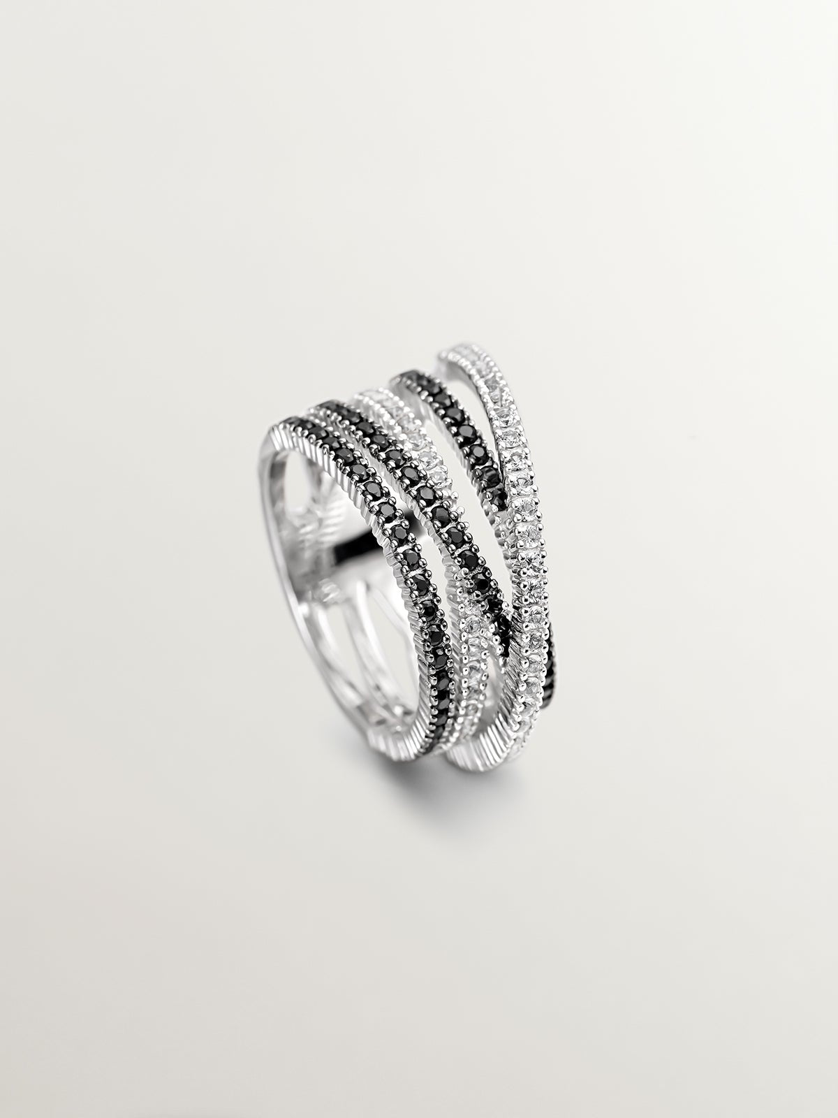 Anillo multibrazo cruzado de plata 925 con topacios blancos y espinelas negras
