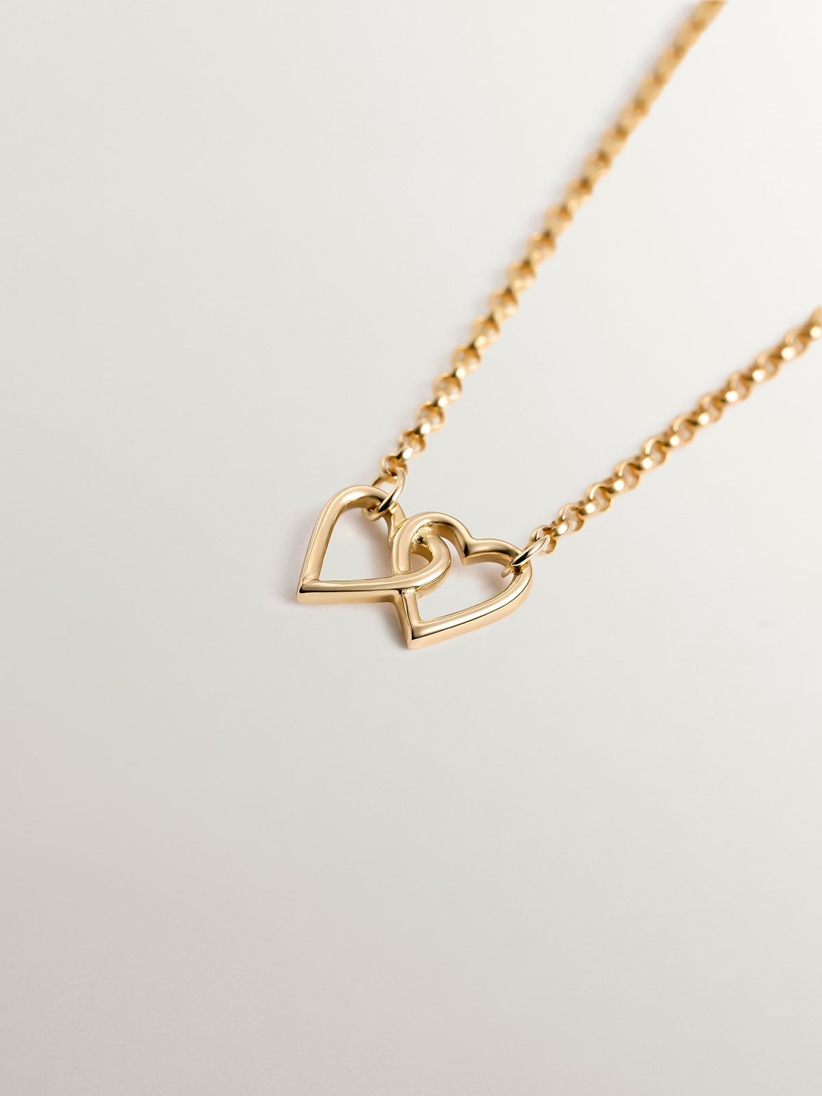 Pulsera de oro amarillo de 9K con corazones entrelazados