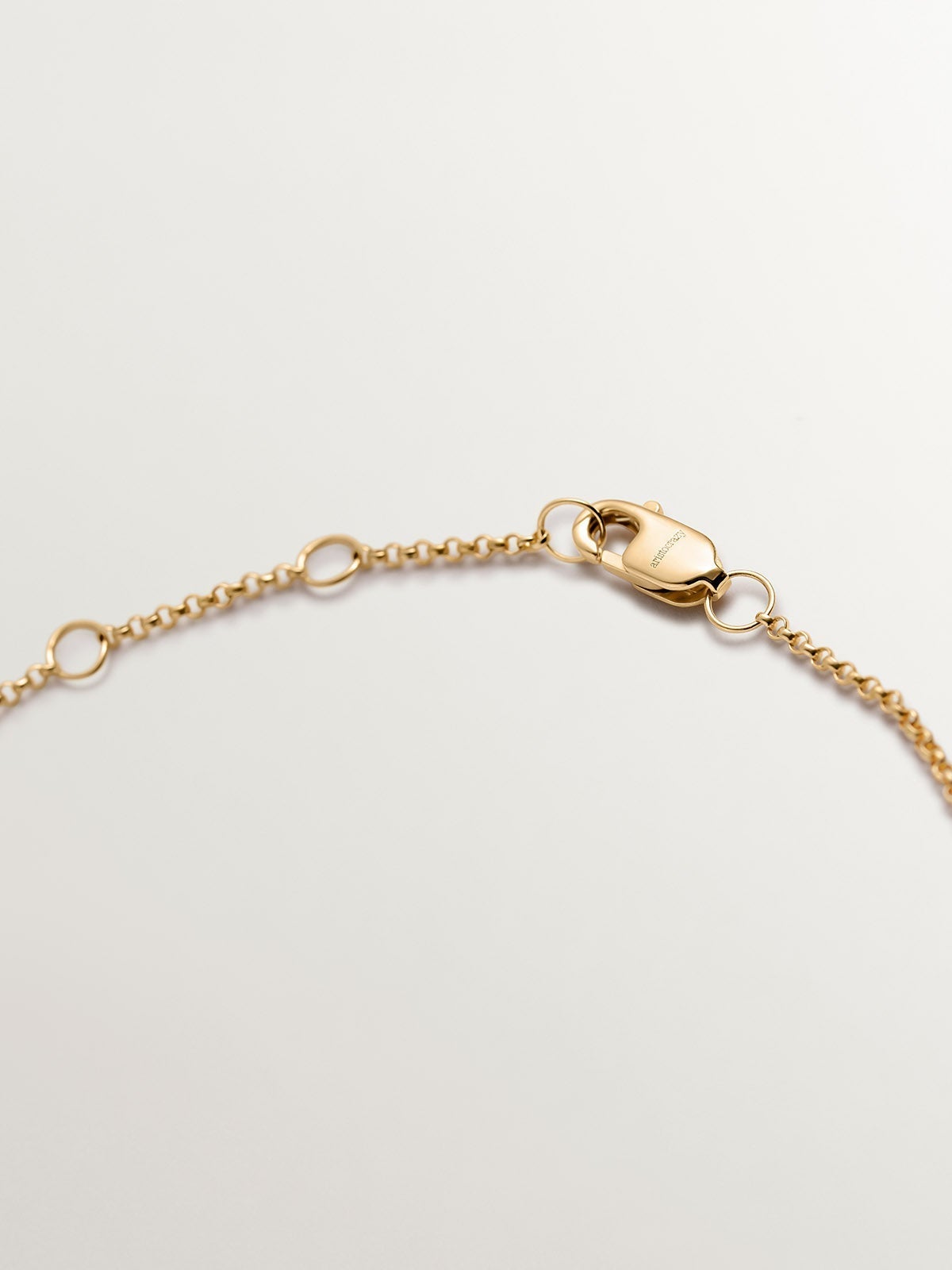 Pulsera de oro amarillo de 9K con corazones entrelazados