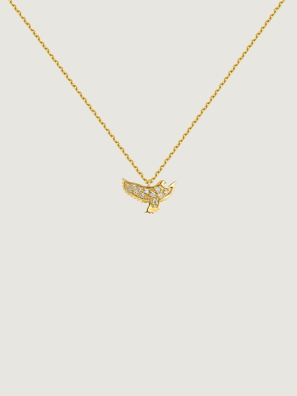 Colgante de oro amarillo de 18K con forma de águila y diamantes