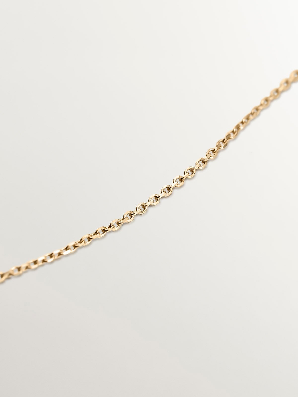 Colgante de oro amarillo de 9K con larimar azul