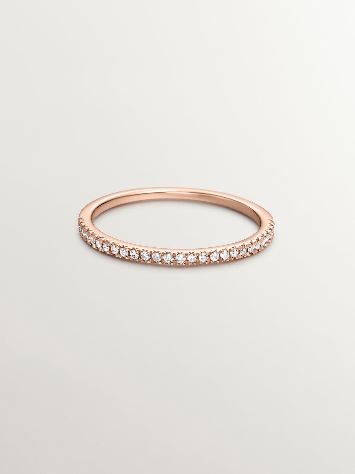 Anillo con halo de diamantes en oro rosa de 0,09 ct