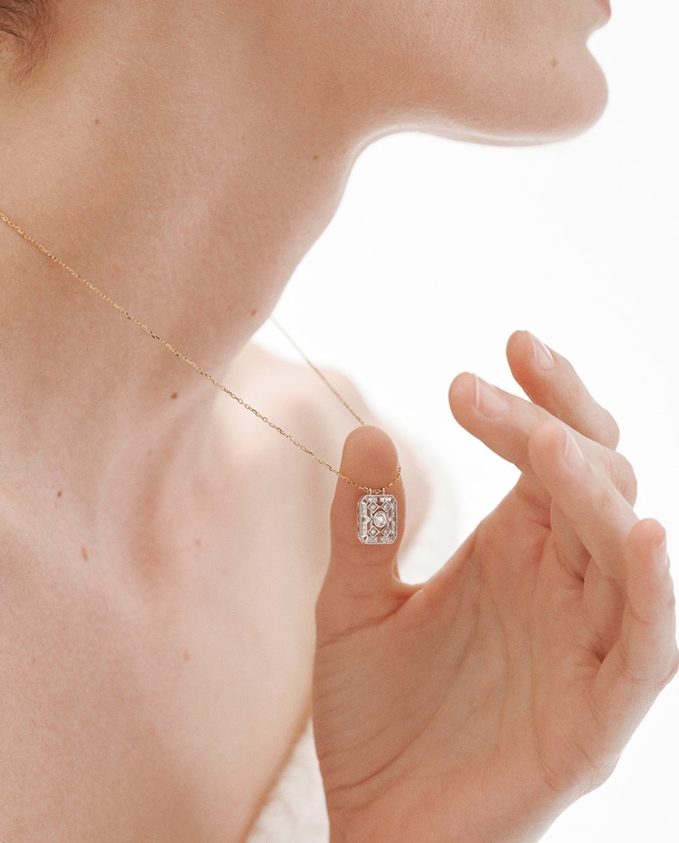 Colgante de oro blanco y amarillo de 18K con diamantes en talla brillante