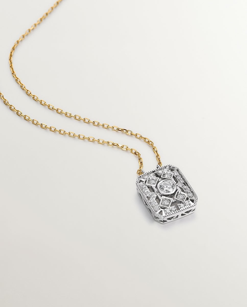 Colgante de oro blanco y amarillo de 18K con diamantes en talla brillante