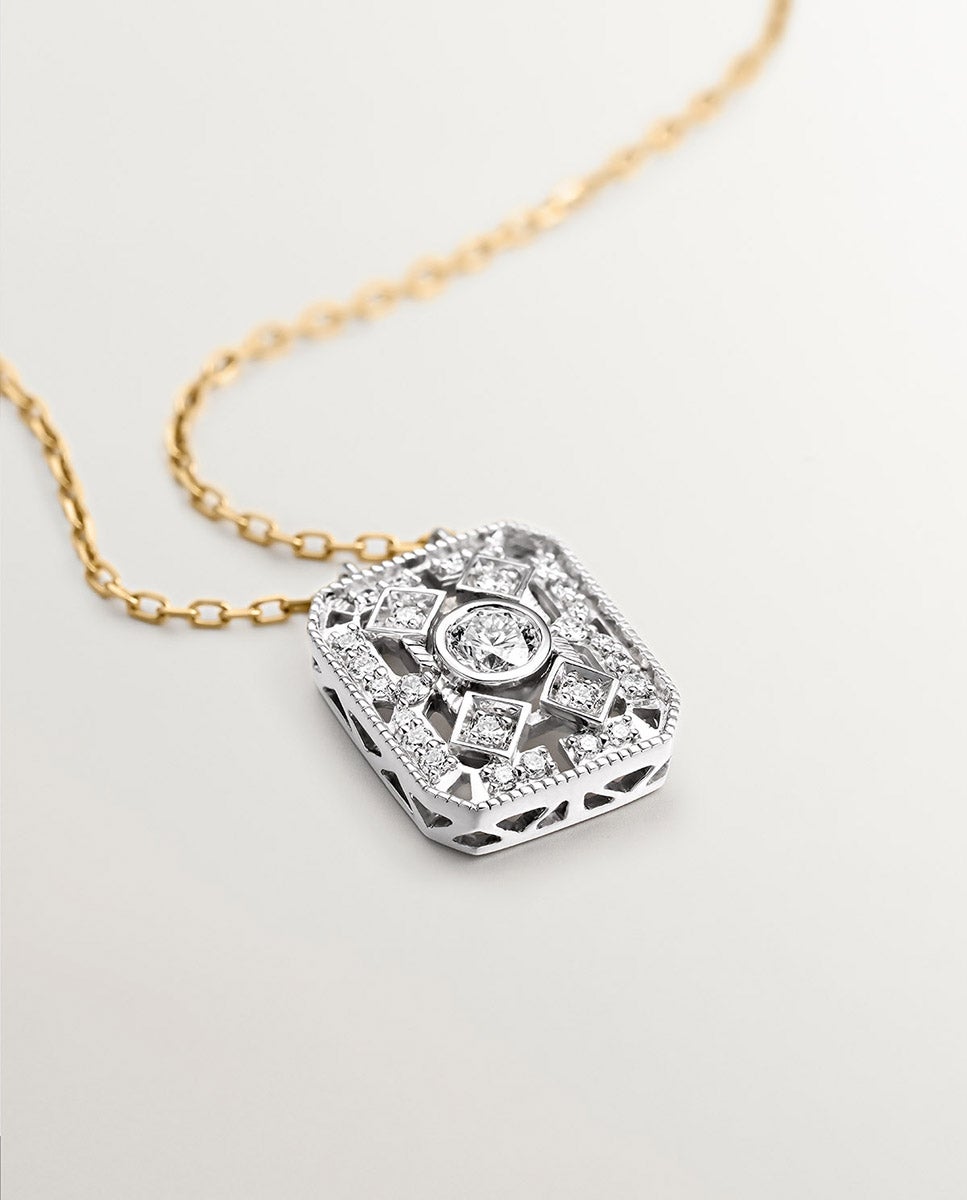 Colgante de oro blanco y amarillo de 18K con diamantes en talla brillante