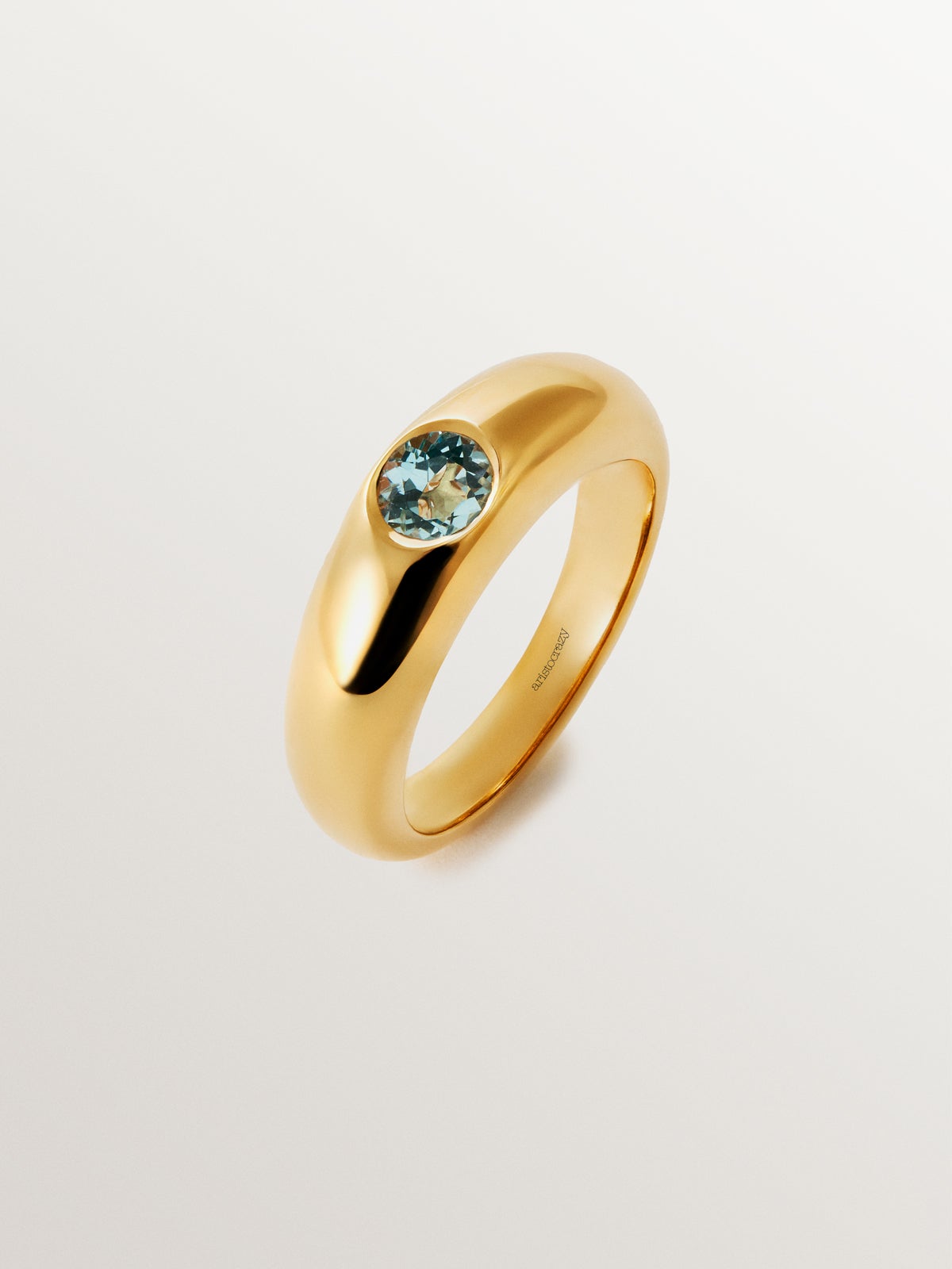 Anillo de plata 925 bañada en oro amarillo de 18K con topacio azul sky