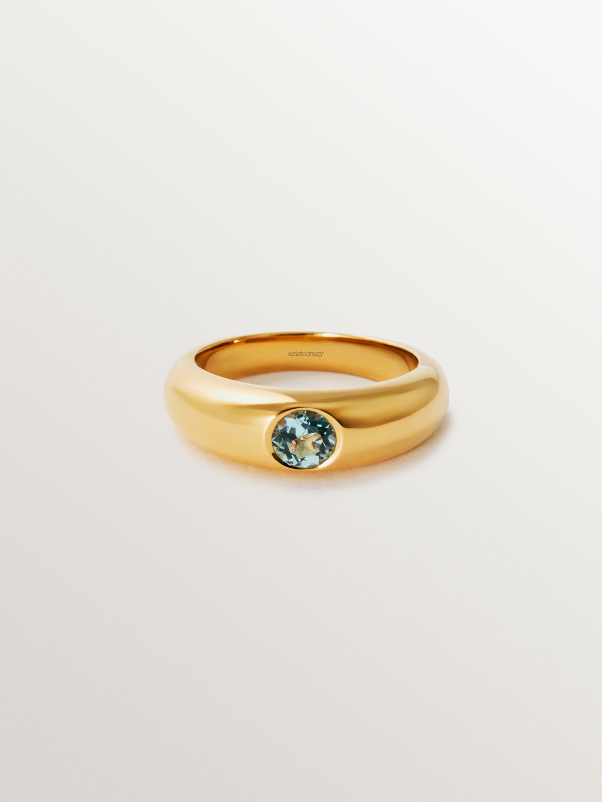 Anillo de plata 925 bañada en oro amarillo de 18K con topacio azul sky
