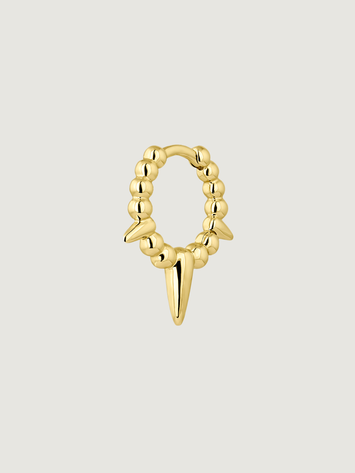 Individual 9K yellow gold earring with balls and spikes.