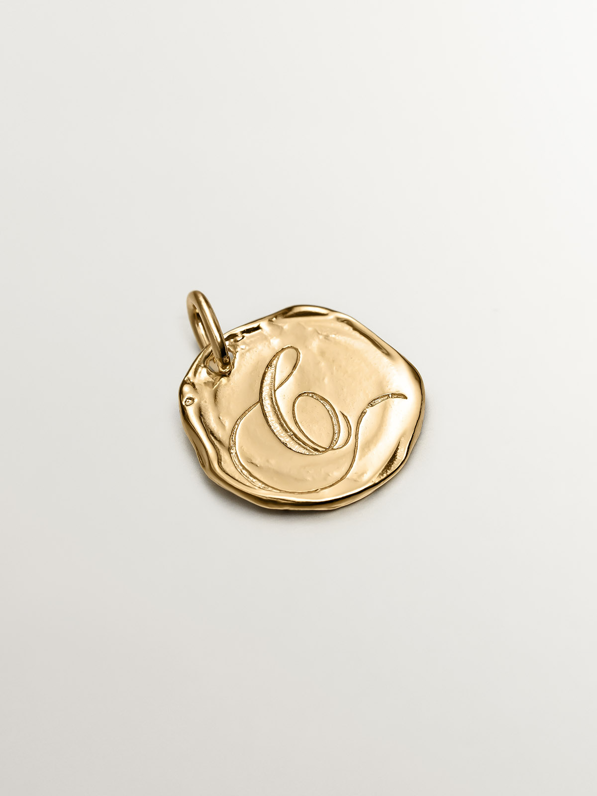 Handcrafted charm made of 925 silver, plated in 18K yellow gold with the initial C.