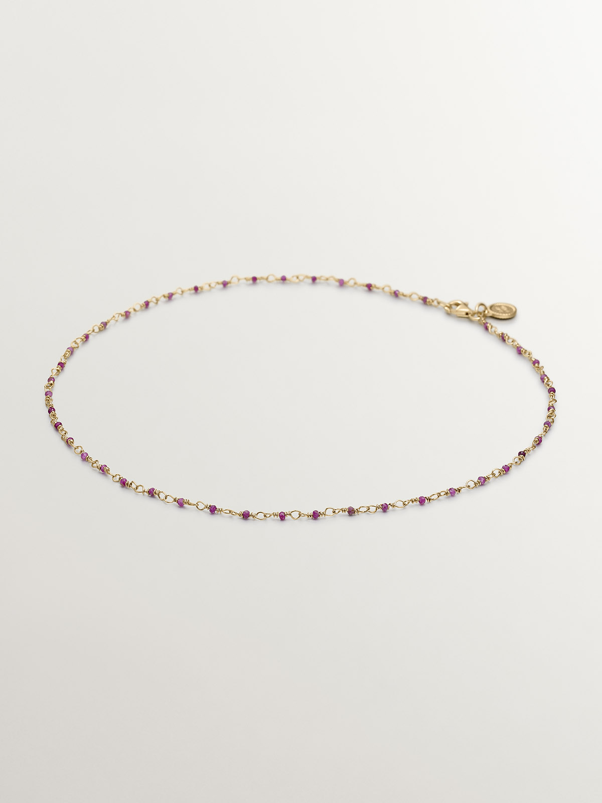 925 Silver chain bathed in 18K yellow gold with pink ruby beads.