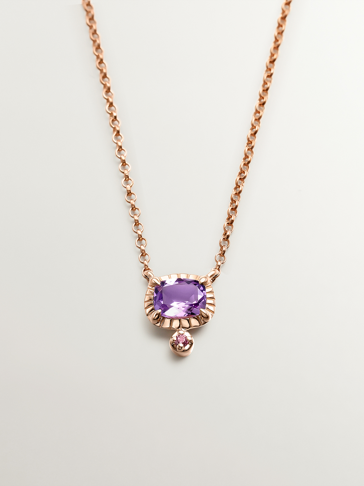 925 Silver pendant dipped in 18K rose gold with purple amethyst and pink rhodolite.