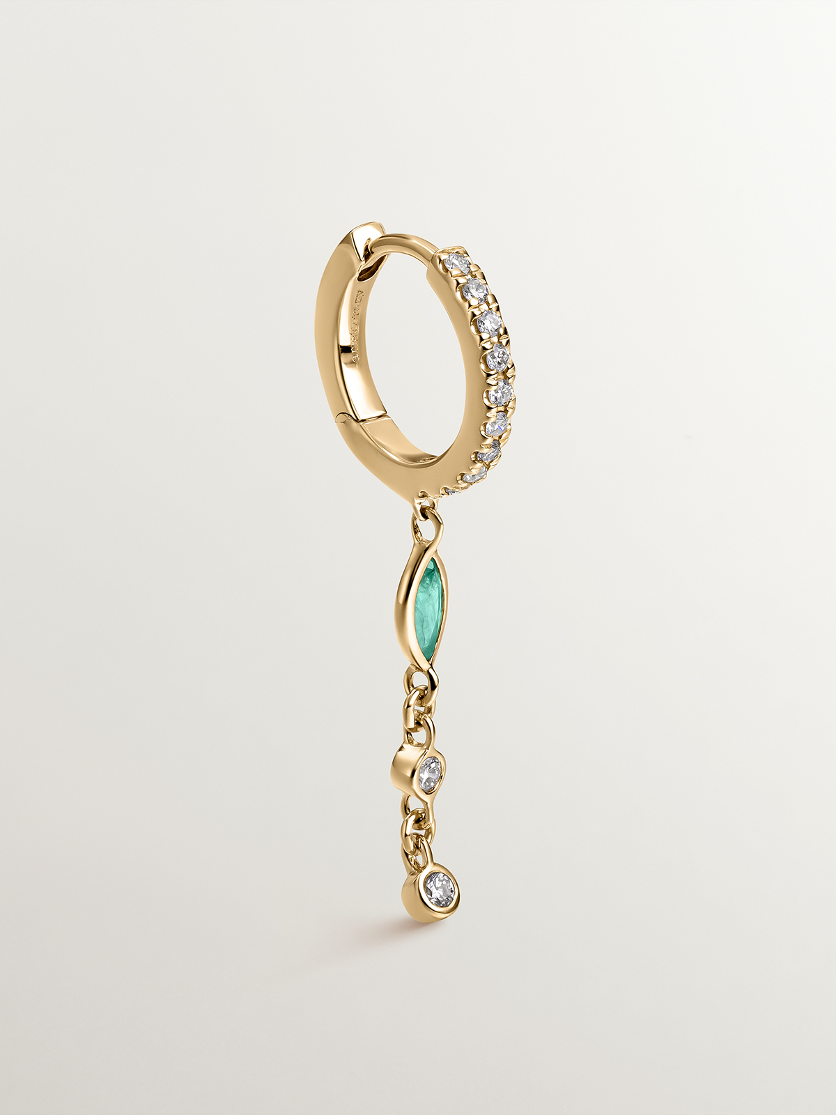 Individual small hoop earring made of 9K yellow gold with a diamond chain and emerald.