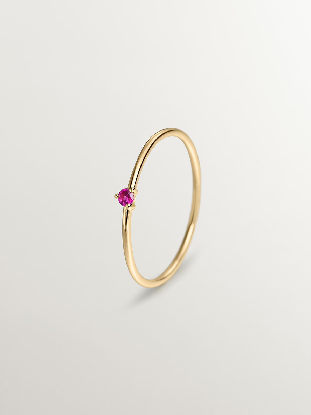 9K yellow gold solitaire ring with red ruby