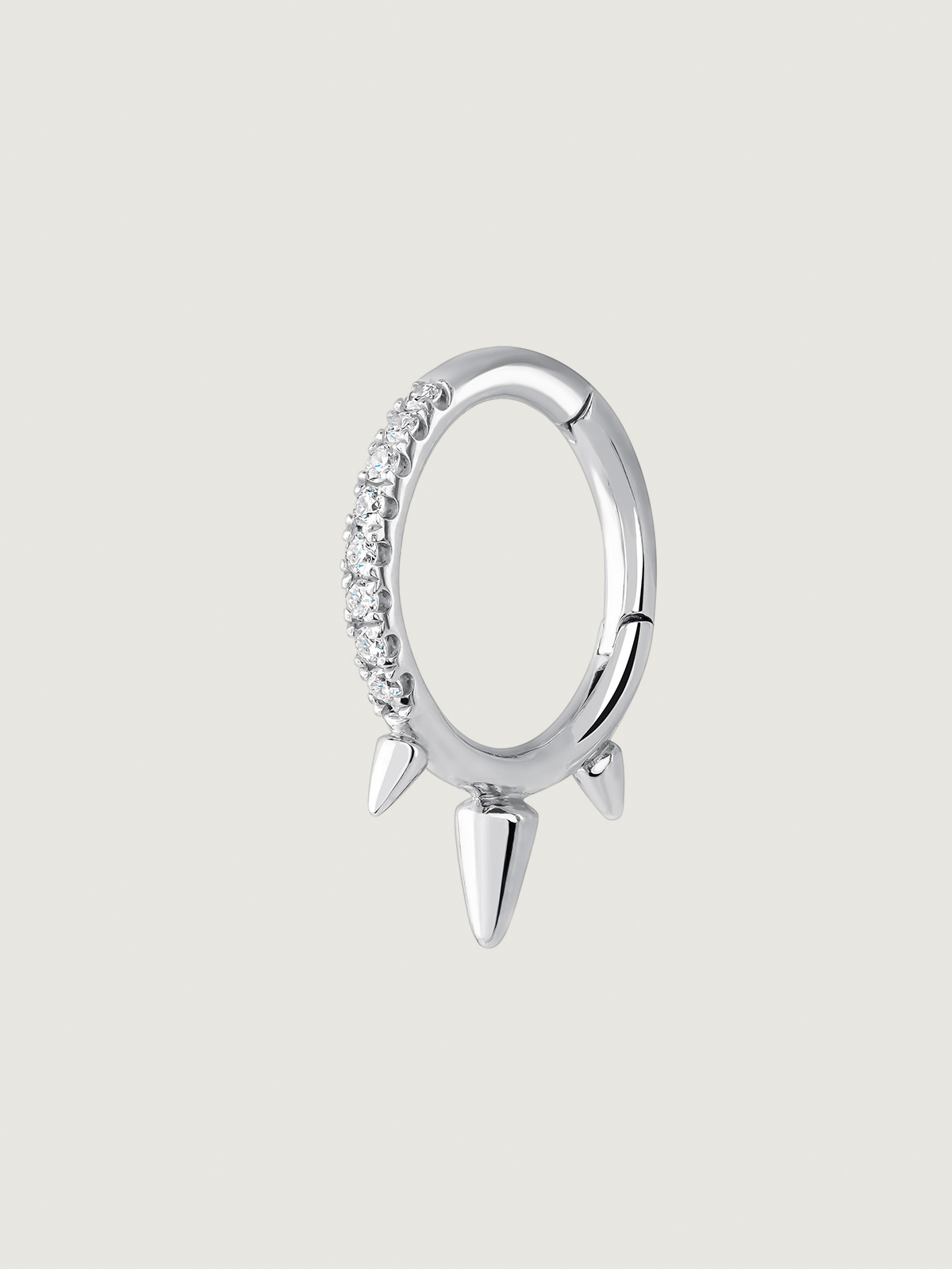 Individual small hoop earring in 9K white gold with spikes and diamonds.