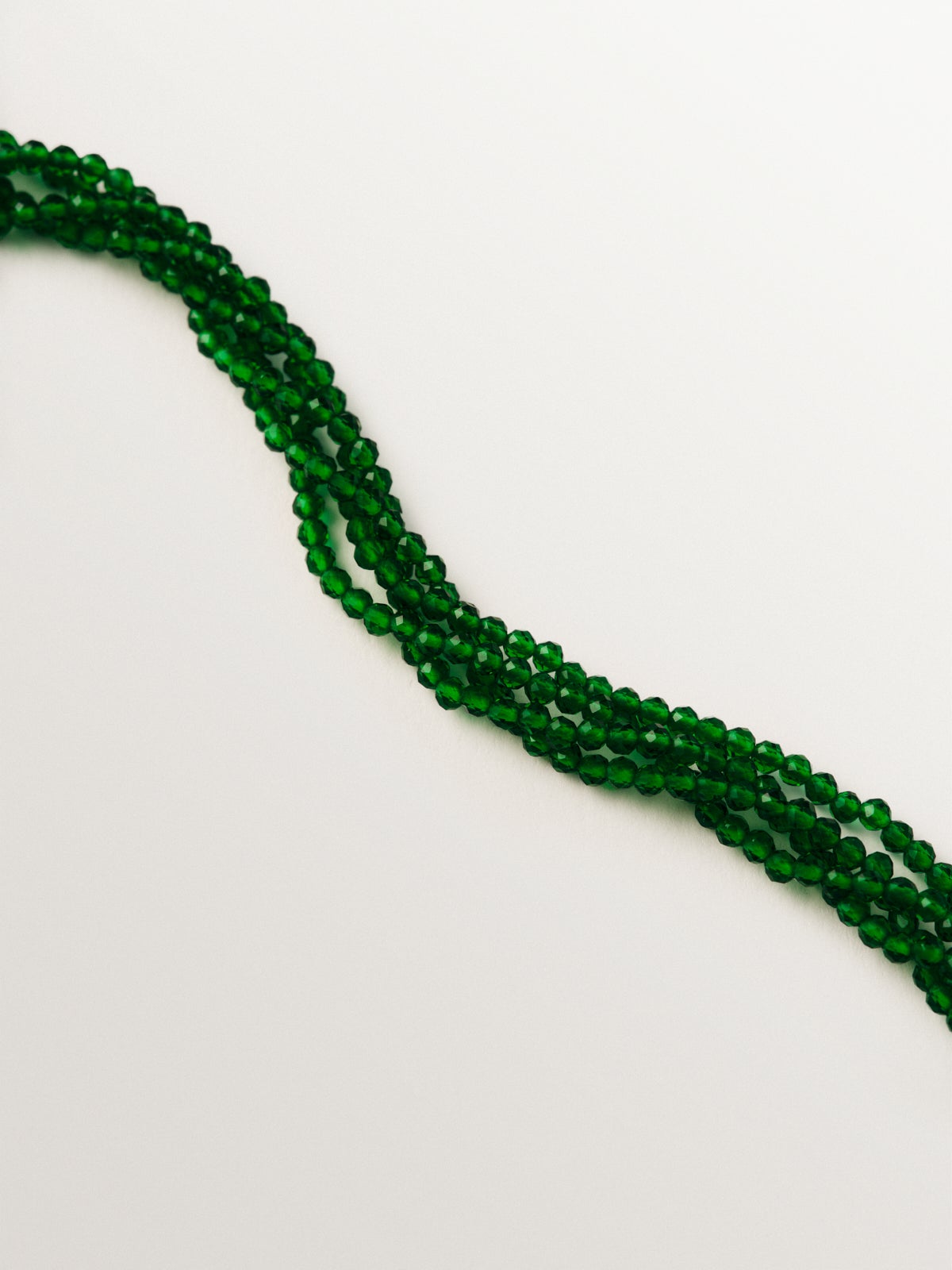 Yellow gold-plated necklace with green crystal beads and beetle shape with purple crystals