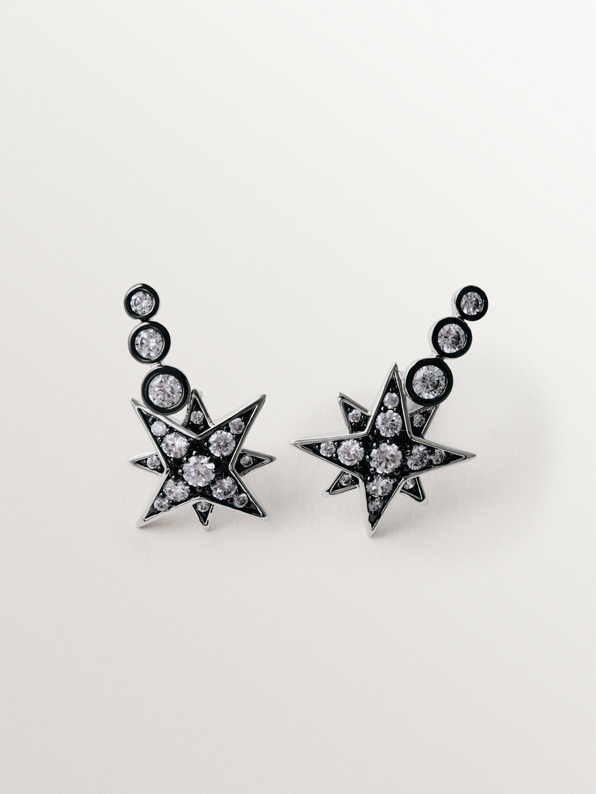 Pendientes trepadores bicolor con cristales en forma de estrella