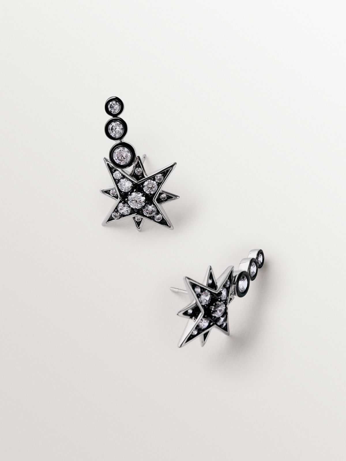Pendientes trepadores bicolor con cristales en forma de estrella