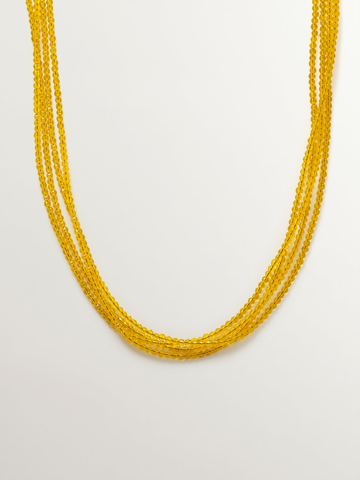 Colgante bañado en oro amarillo con cristales amarillos