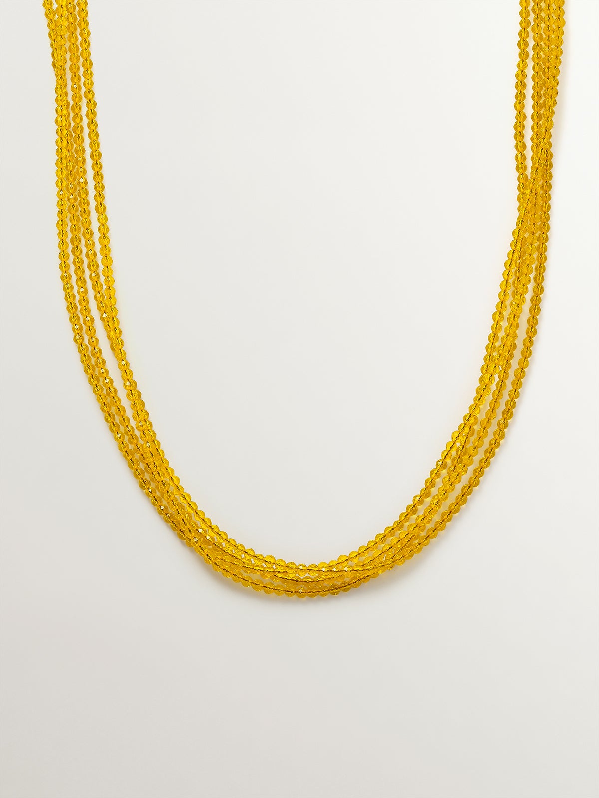 Colgante bañado en oro amarillo con cristales amarillos