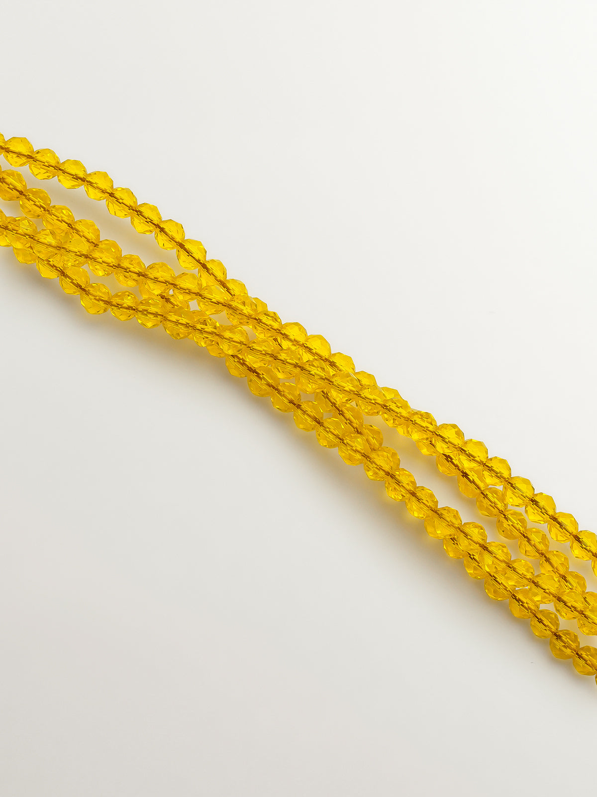 Colgante bañado en oro amarillo con cristales amarillos