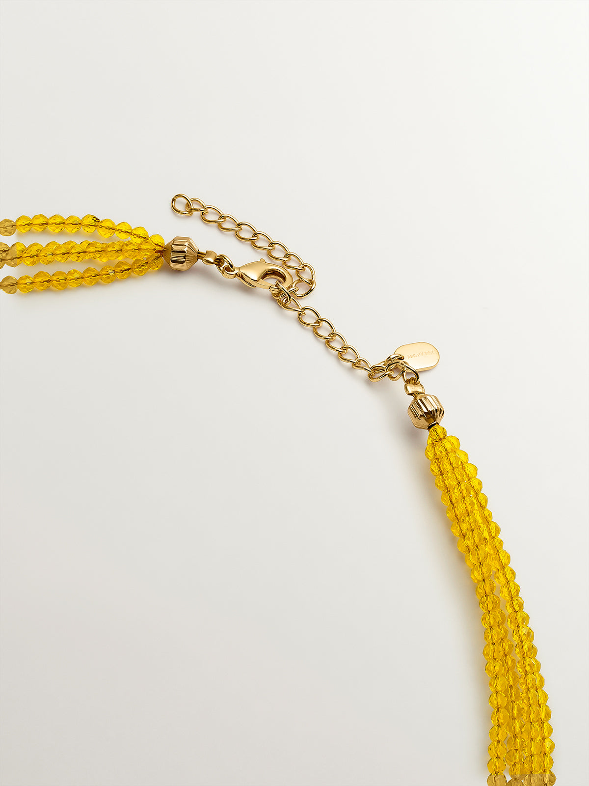 Colgante bañado en oro amarillo con cristales amarillos