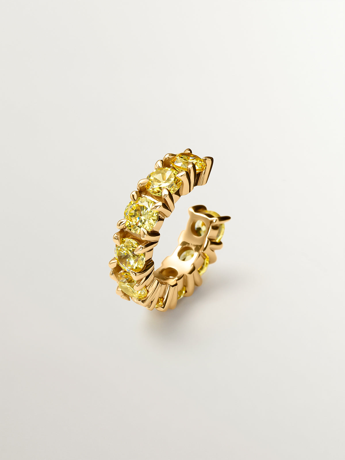 Earcuff bañado en oro amarillo con cristales amarillos