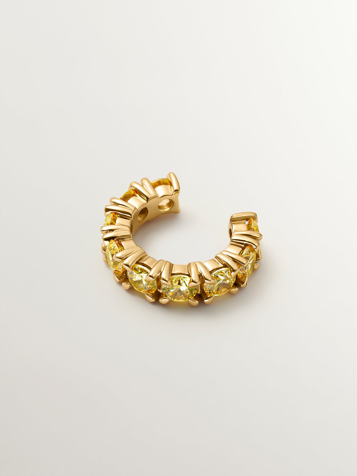 Earcuff bañado en oro amarillo con cristales amarillos
