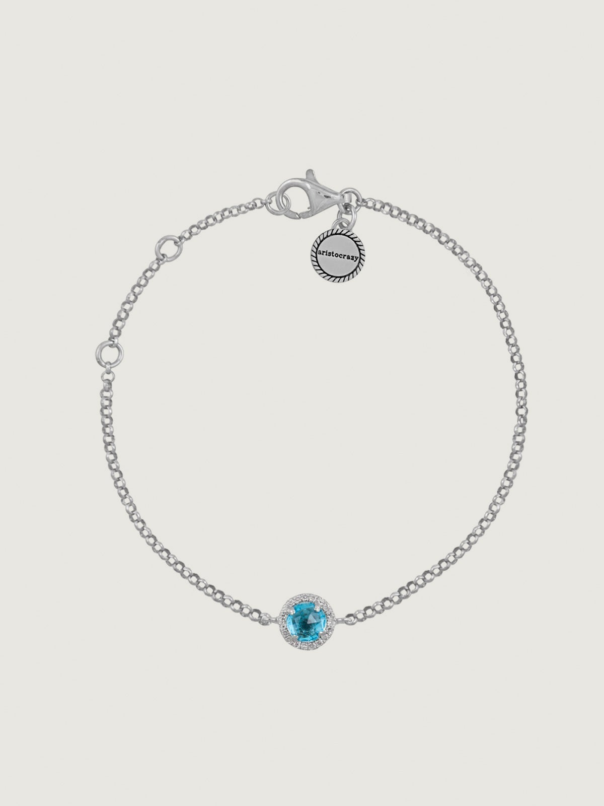 Pulsera de plata 925 con topacio azul y orla de zafiros blancos