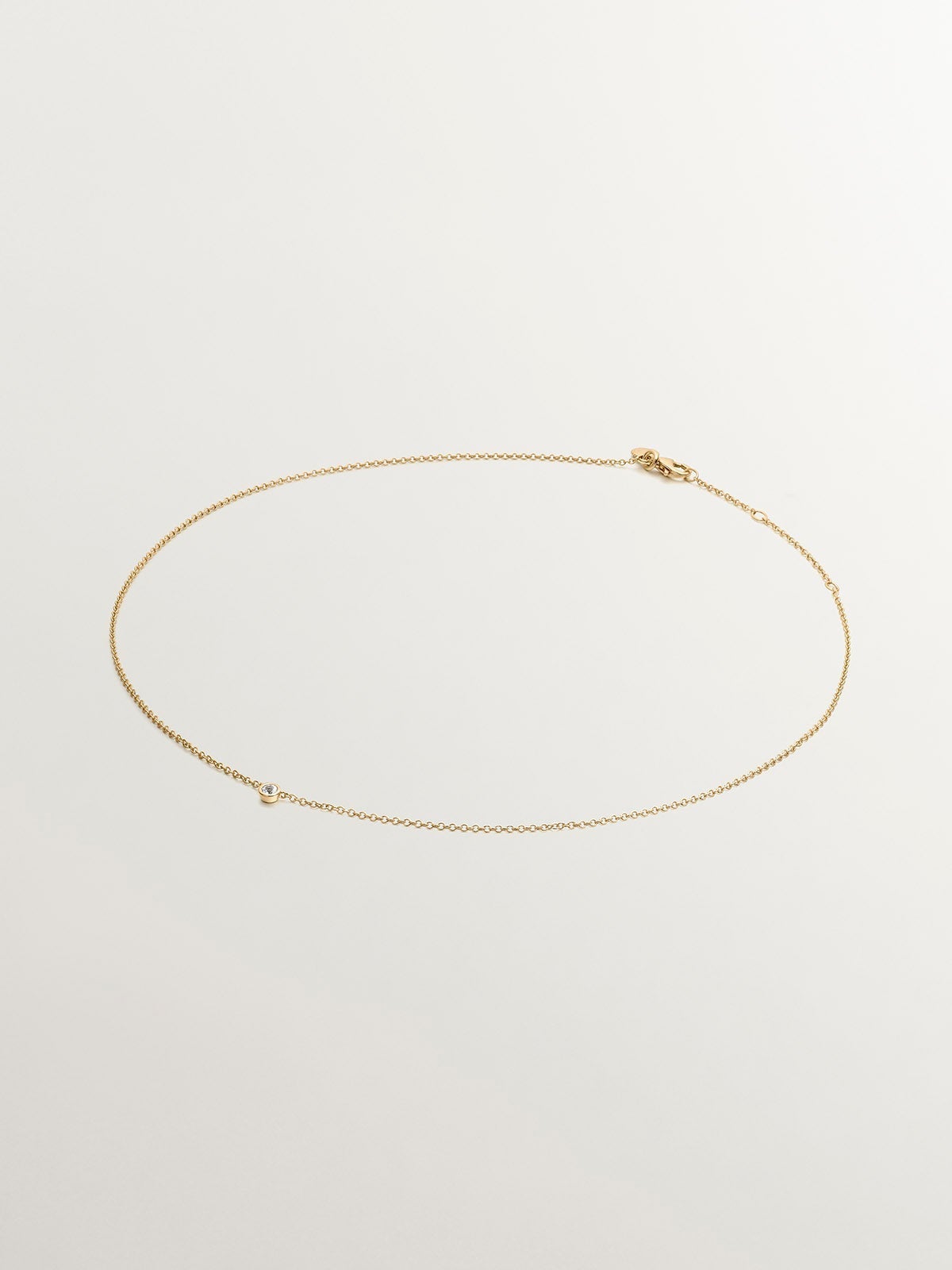 Colgante solitario de plata 925 bañada en oro amarillo de 18K con topacio blanco