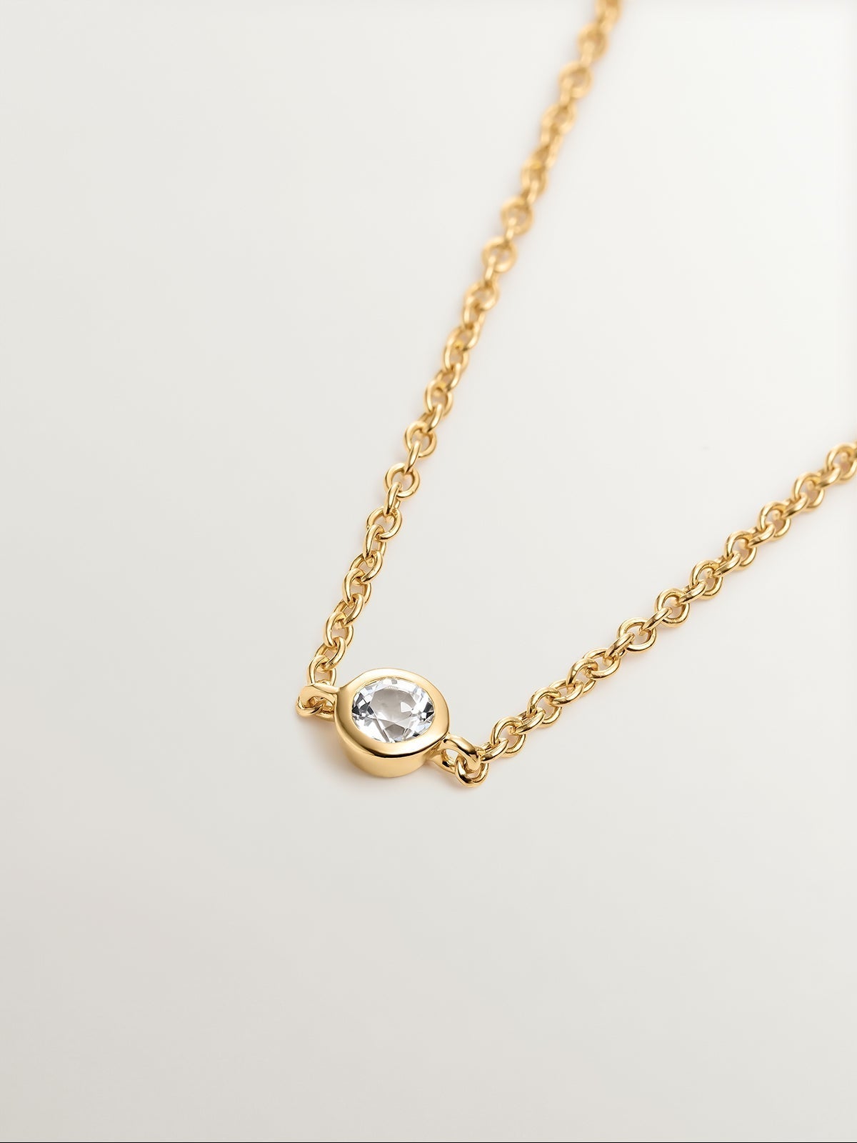 Pulsera solitario de plata 925 bañada en oro amarillo de 18K con topacio blanco