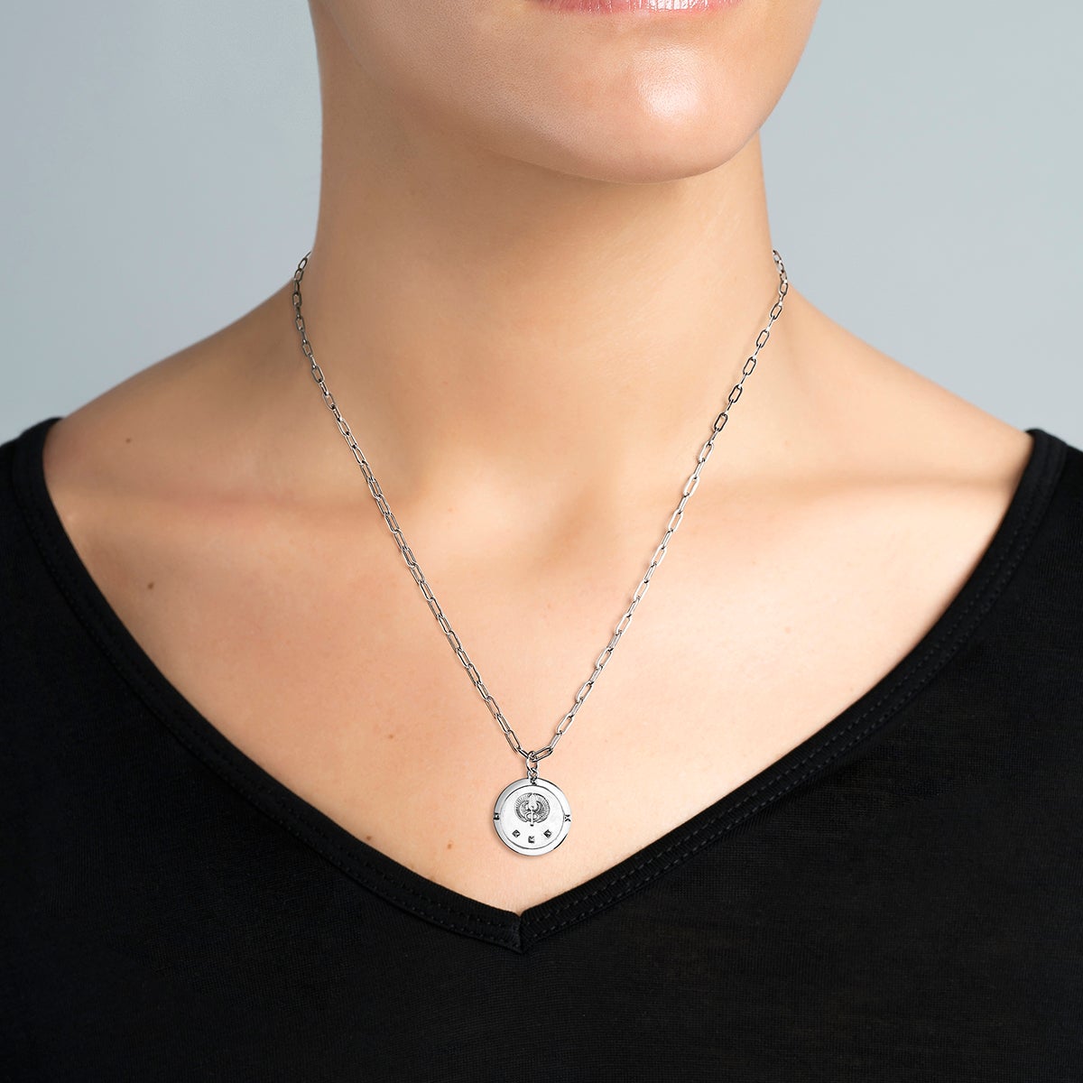 Colgante de moneda de estrella de plata