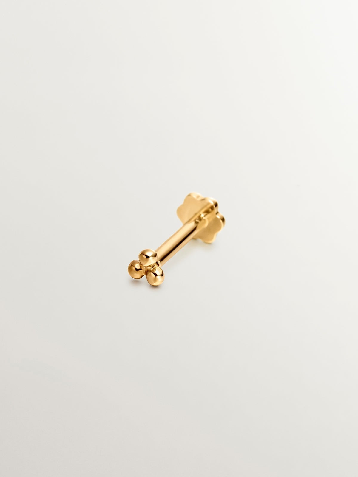 Piercing de oro amarillo de 18K con triple bolita
